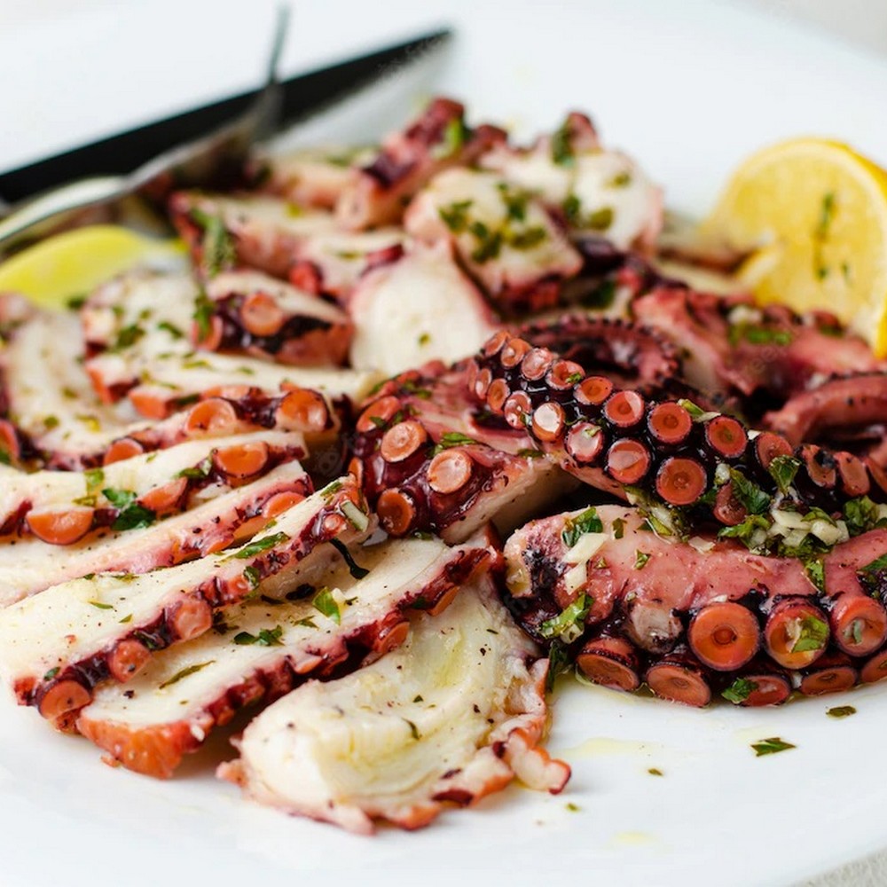 An octopus dish with lemon and herbs