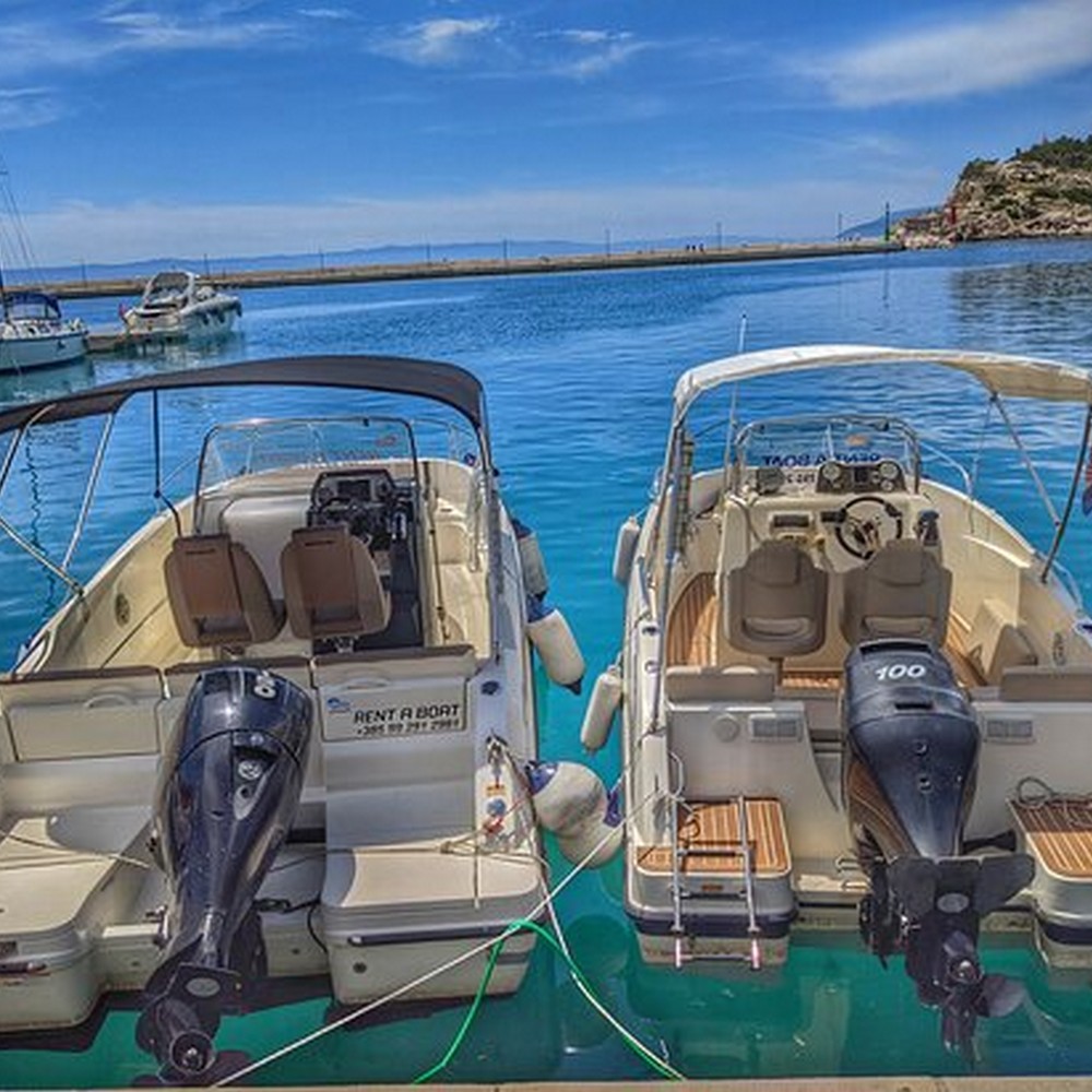 Two rental motorboats moored in the harbour